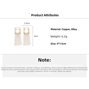 Detail view of 14k gold plated tassel earrings showing size 4cm by 1.5cm and 6.2g weight