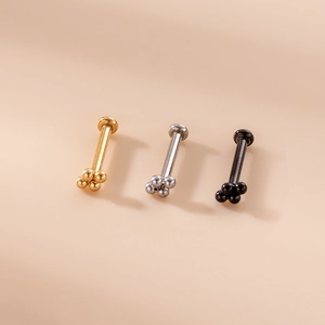 Set of 16G stainless steel labret studs with five-ball cluster design in gold, silver, and black