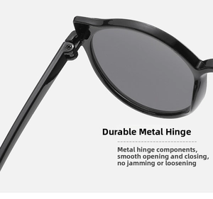 Close-up of the durable metal hinge and reinforced screw on black cat-eye kids sunglasses