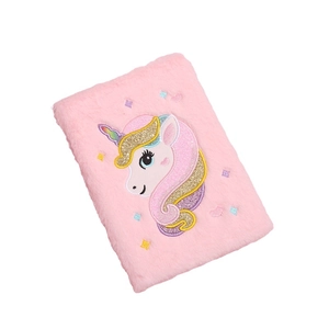 Pink plush unicorn notebook with 3D embroidery and glitter accents on white background