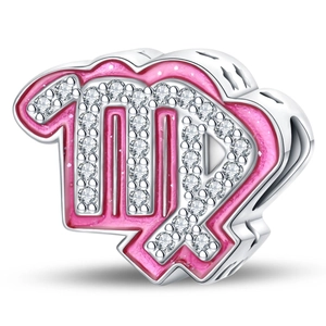 Macro shot of silver Virgo zodiac charm with pink enamel and sparkling zircon accents