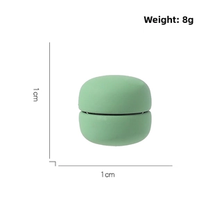 Macro detail of a mint green magnetic scarf buckle showing 1cm dimensions and 8g weight