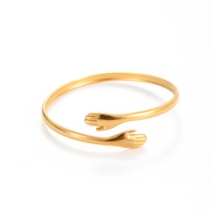 Wide gold stainless steel hug bracelet with elegant leaf cutout and adjustable open design
