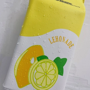 Crossbody bag shaped like a lemon milk carton with leather cross texture and waterproof finish