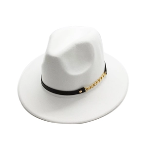 Detailed view of white fedora hat featuring a black leather band and gold chain accent