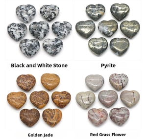 Macro display of heart-shaped pyrite, golden jade, and red grass flower stones