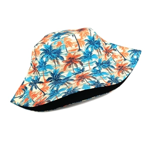 Detail of tropical palm tree print on summer bucket hat with high quality stitching