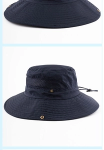 Detail of navy blue sun hat with mesh side panels and breathable metal vents