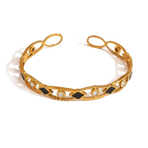 Bracelet empilable en acier doré avec motifs croix noirs et cristaux de strass brillants