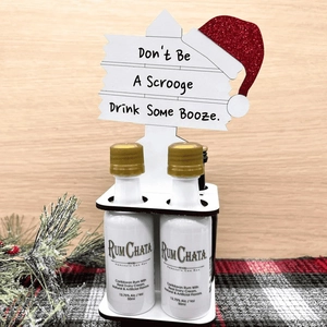 Mini wooden Christmas liquor bottle holder with humorous road sign design and santa hat