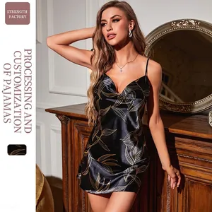 Satin sleepwear dress in black with gold leaf print featuring cowl neck and thin straps