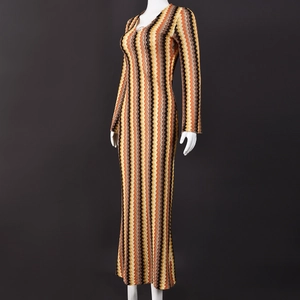 Detail of multi-color wavy zigzag knit texture on long sleeve slim fit dress