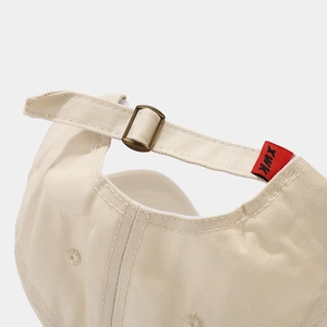 Minimalist beige baseball cap with adjustable metal buckle and twill fabric detail