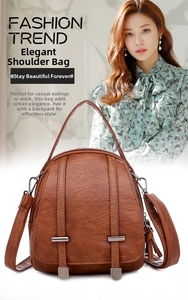 Close-up of brown vintage crossbody bag featuring lychee texture and fringe tassel detail