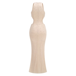 Detailed back view of nude evening gown with heavy beadwork and mesh fishtail hem