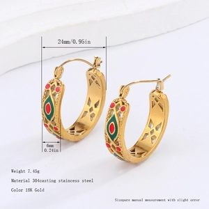 Detail view of 18K gold plated stainless steel hoop earrings with colorful enamel inlay