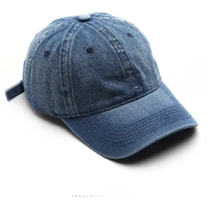 Close-up of Pamela Rain embroidery on a retro washed blue denim baseball cap detail