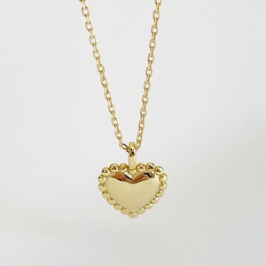 Elegant 925 sterling silver heart necklace in golden finish with beaded edges on white background