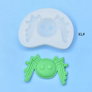 Macro view of XL size spider silicone mold and green finished product for cake baking