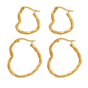 Minimalist gold wavy stud earrings set featuring four irregular twisted metal hoops