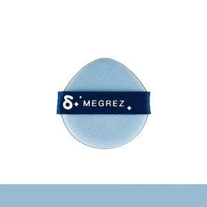 Macro detail of a soft light blue teardrop makeup sponge with brand name ribbon handle
