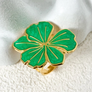 Vintage gold plated stainless steel ring featuring a green enamel flower design