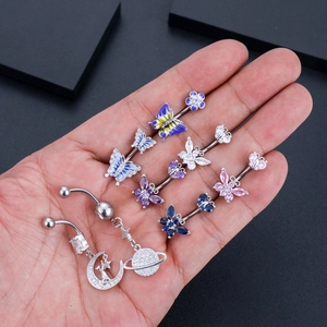 Set of 8 zircon navel rings featuring butterfly, flower, moon and planet designs