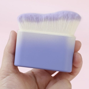 Detailed view of the wavy purple gradient bristles and handle on a large foundation brush