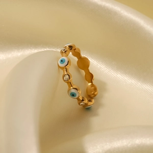 18K gold plated evil eye open ring with blue enamel and clear zircon on silk background