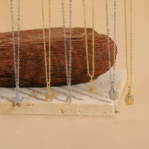 Minimalist ocean-themed zircon starfish and shell necklaces in gold and silver finish