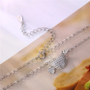 Polished silver S925 heart candy pendant necklace featuring pavé set sparkling diamonds
