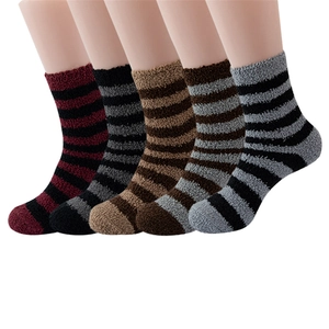 Detail view of five pairs of striped coral fleece crew socks in various colors for men