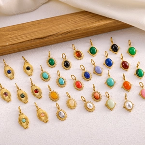 Fashionable gold stainless steel oval pendants set with colorful natural stones