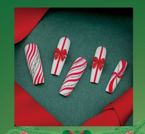 Extra long red and white Christmas press-on nails with candy stripes and 3D bow details