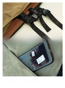 Detail of durable apron featuring adjustable plastic buckle and a large utility side pocket