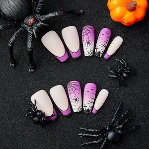 Matte purple Halloween press-on nails with spider web, bat and graveyard gradient design