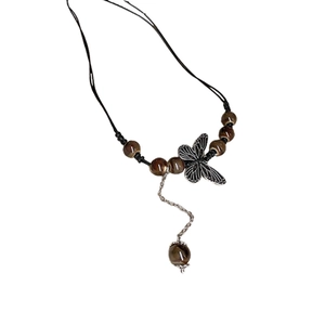 Ethnic beaded necklace with butterfly pendant and silver chain fringe on black cord