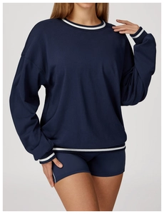 Detail of navy sweatshirt set with white striped cuffs and athletic round neck design