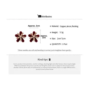 Detailed view of red flocked flower earrings with pearl accents and 2cm size specifications