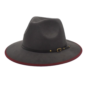 Detail of charcoal grey wool fedora with burgundy velvet edge and leather buckle band