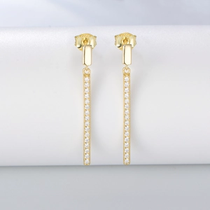 Detail of 925 sterling silver stamp on long gold tassel earrings with zircon stones