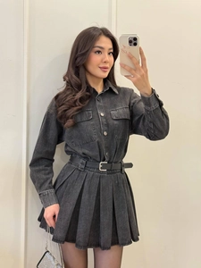 Dark grey denim shirt dress with pleated skirt and black waist belt in a mirror selfie view