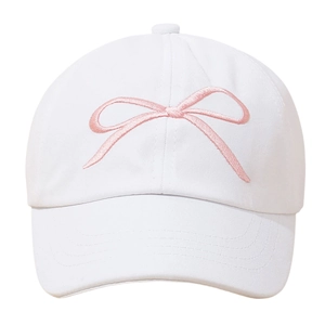 Close-up of white cotton baseball cap featuring delicate pink bow embroidery details