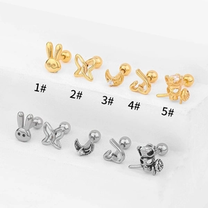 Detail view of 316L stainless steel bunny moon cartilage earrings with ball back closures