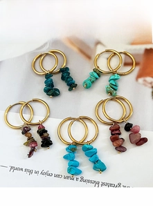 Detailed shot of bohemian gold hoop earrings with natural multi-color stone beads