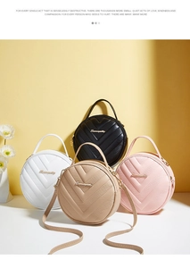 Detail showing various colors of V-quilted small round shoulder bags in PU leather