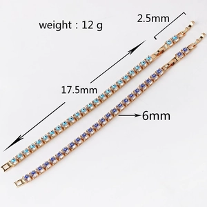 Detailed close-up of golden Evil Eye chain bracelets with blue zircon and weight specs