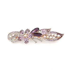 Golden flower hair clip with purple rhinestones and crystal leaf detail for women