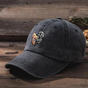 Close-up of vintage washed grey cotton baseball cap with cartoon bear graphic embroidery
