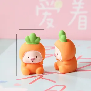 Macro detail of cute mini pig figurines wearing orange carrot costumes for micro landscape